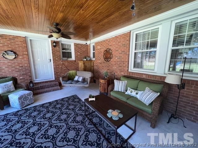 406 Old Post Road Erwin, NC 28339 - Photo 18 of 30 a outdoor living space with furniture and a couch