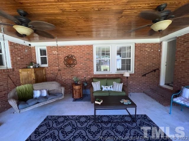 406 Old Post Road Erwin, NC 28339 - Photo 19 of 30 a living room with furniture and a rug