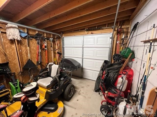 406 Old Post Road Erwin, NC 28339 - Photo 20 of 30 a view of walk in closet with clothes and shoes