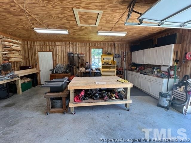 406 Old Post Road Erwin, NC 28339 - Photo 22 of 30 a large bed sitting in a room next to a window