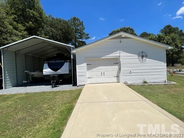 406 Old Post Road Erwin, NC 28339 - Photo 27 of 30 a view of a house with a yard