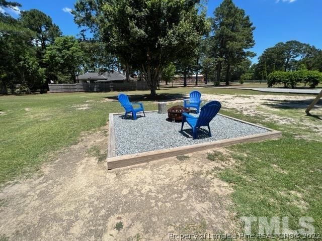 406 Old Post Road Erwin, NC 28339 - Photo 28 of 30 a park view with a bench