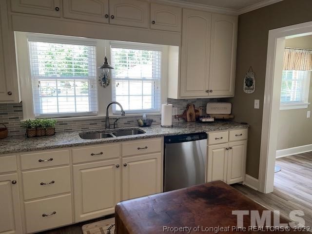 406 Old Post Road Erwin, NC 28339 - Photo 4 of 30 a kitchen with granite countertop a sink cabinets and window