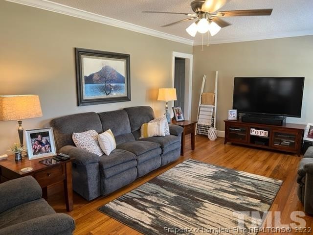 406 Old Post Road Erwin, NC 28339 - Photo 7 of 30 a living room with furniture and a flat screen tv