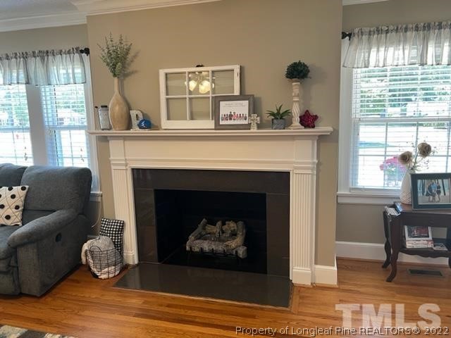 406 Old Post Road Erwin, NC 28339 - Photo 8 of 30 a living room with furniture and a fireplace