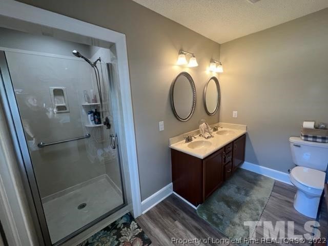 406 Old Post Road Erwin, NC 28339 - Photo 10 of 30 a bathroom with a sink mirror and shower