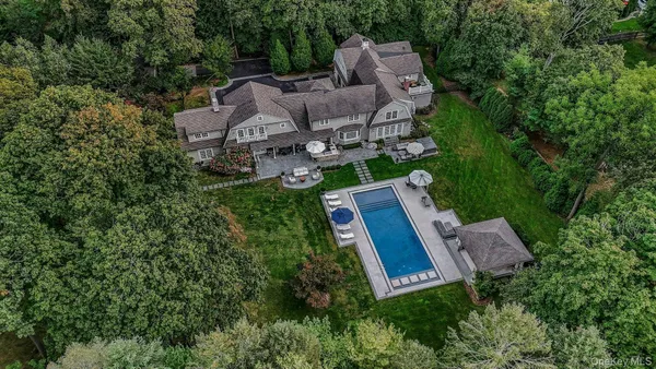 an aerial view of a house with a garden