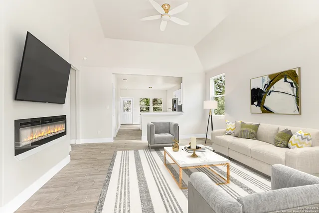 a living room with furniture and a fireplace
