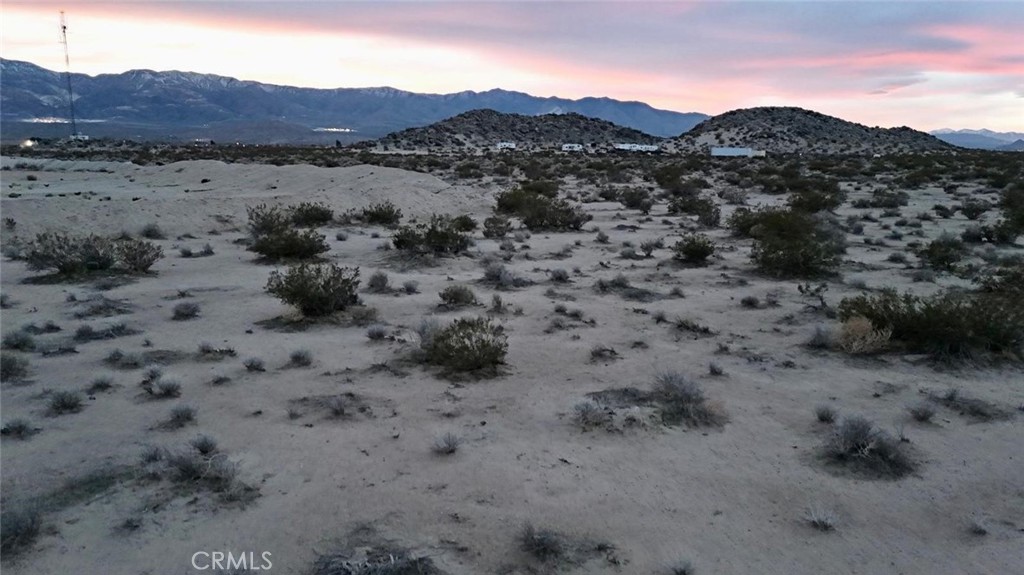 40 Rodeo Lucerne Valley Lucerne Valley, CA 92356 - Photo 5 of 10 a view of a dry field with mountains in the background