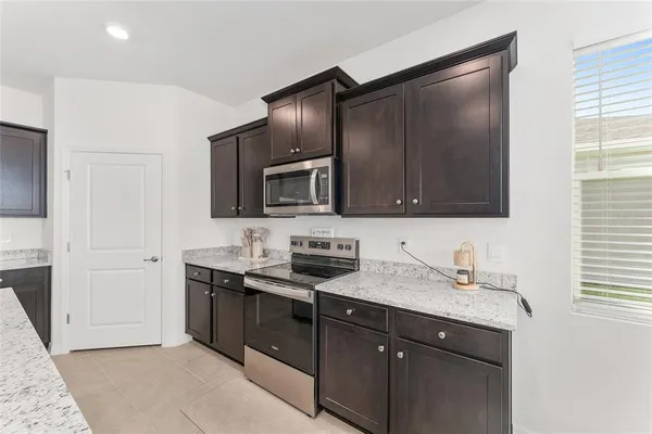 a kitchen with a sink and stove