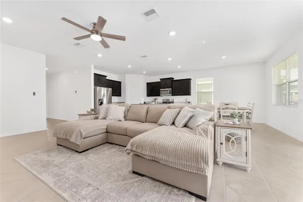 a bedroom with a bed chair and a window