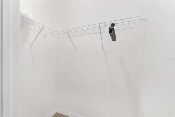 a bed room with a bed and a window