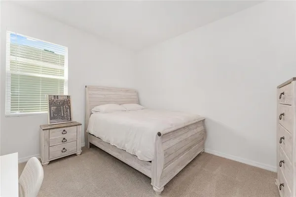 a view of a patio with a table and chairs