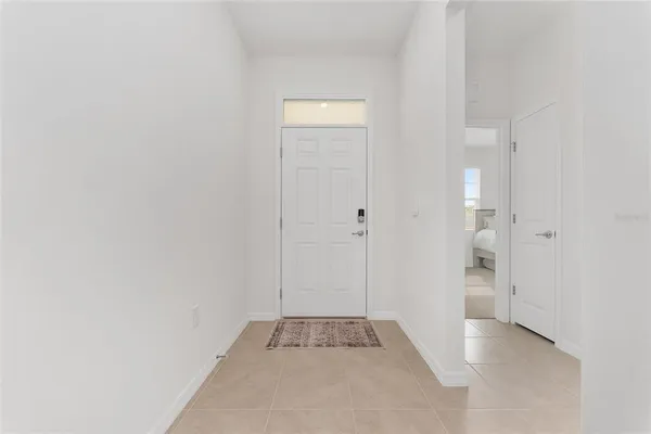 a large kitchen with a table and chairs
