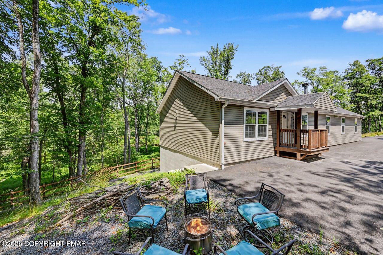 2016 Locust Ridge Road Pocono Lake, PA 18347 - Photo 3 of 82 a backyard of a house with seating space