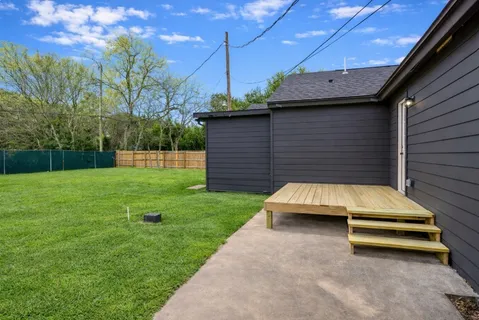a view of a backyard with sitting area