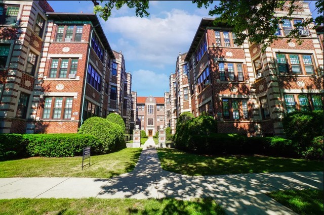 618 Sheridan Road, Unit 1 Evanston, IL 60202 - Photo 1 of 1 a view of a brick building next to a yard