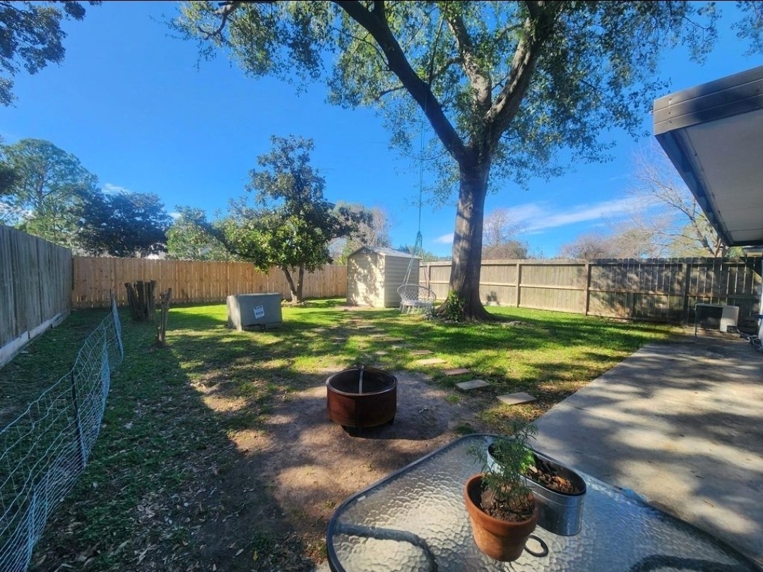 13715 Vickston Lane Houston, TX 77014 - Photo 1 of 11 a view of a backyard with plants and patio