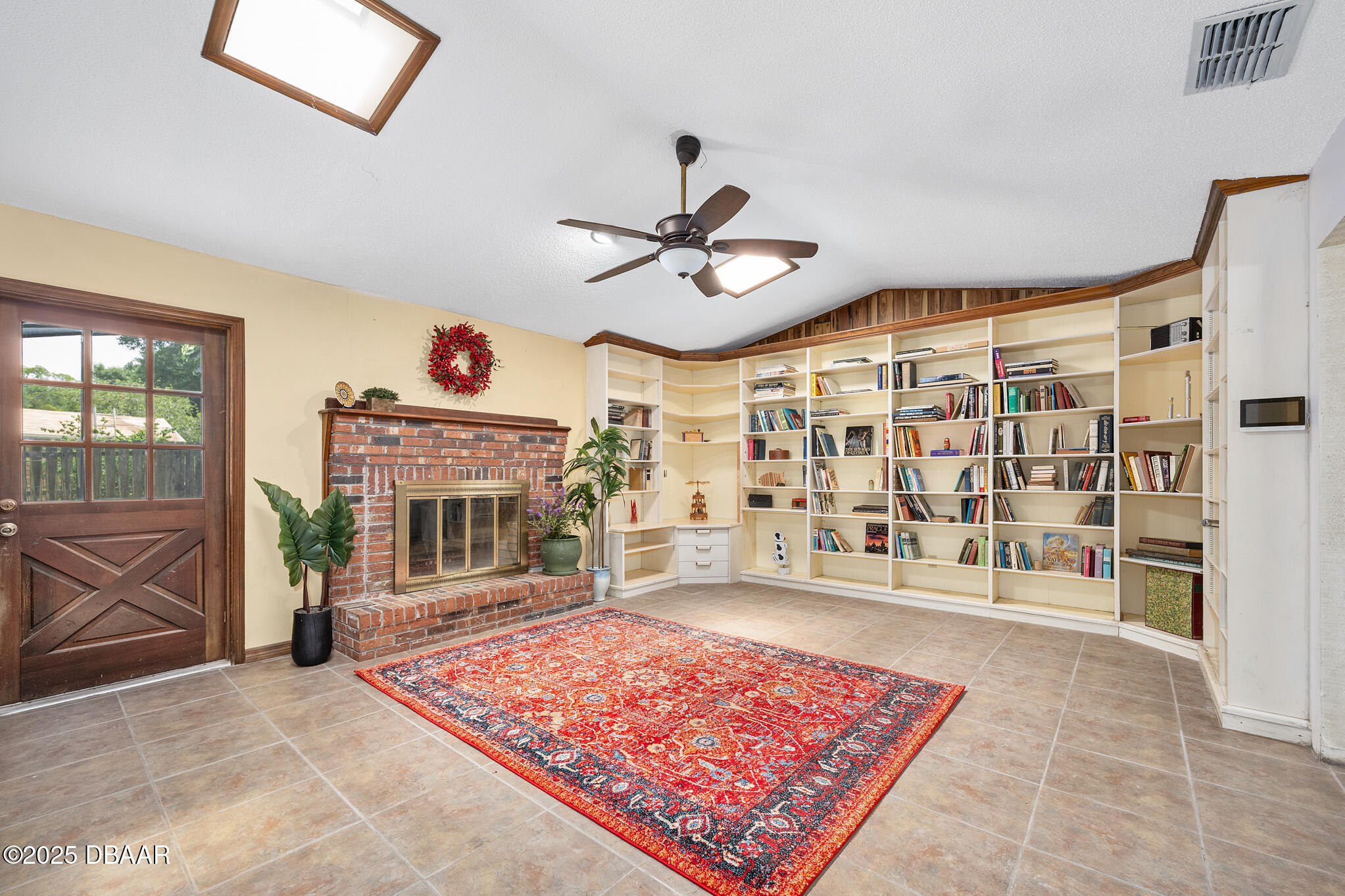1 River Bluff Court Ormond Beach, FL 32174 - Photo 12 of 58 a living room with a couch and a fireplace