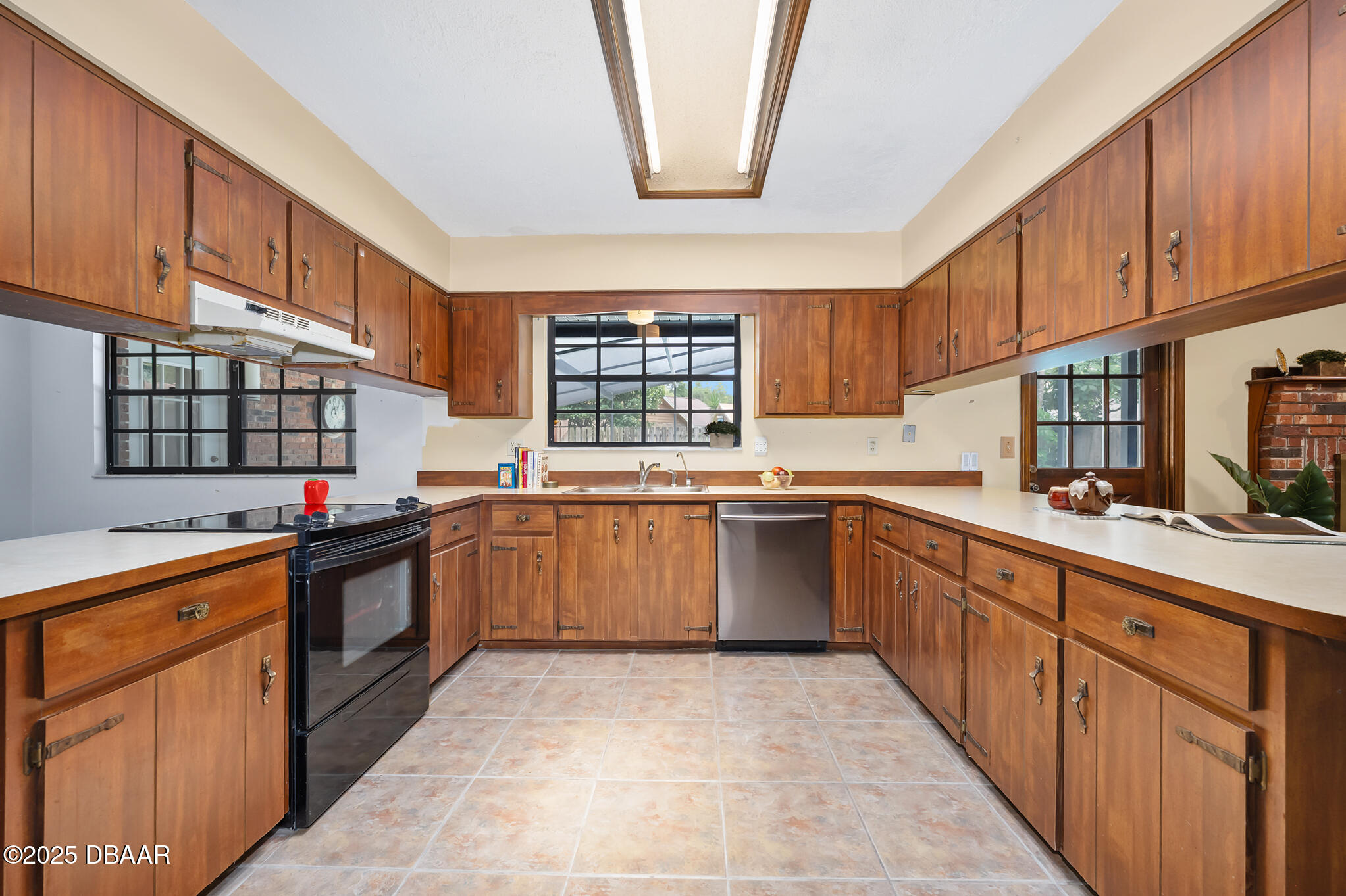 1 River Bluff Court Ormond Beach, FL 32174 - Photo 15 of 58 a kitchen with stainless steel appliances granite countertop a stove sink and cabinets