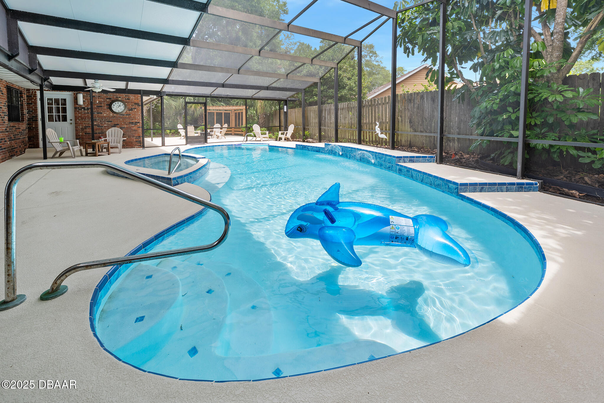 1 River Bluff Court Ormond Beach, FL 32174 - Photo 19 of 58 a view of a swimming pool with a yard