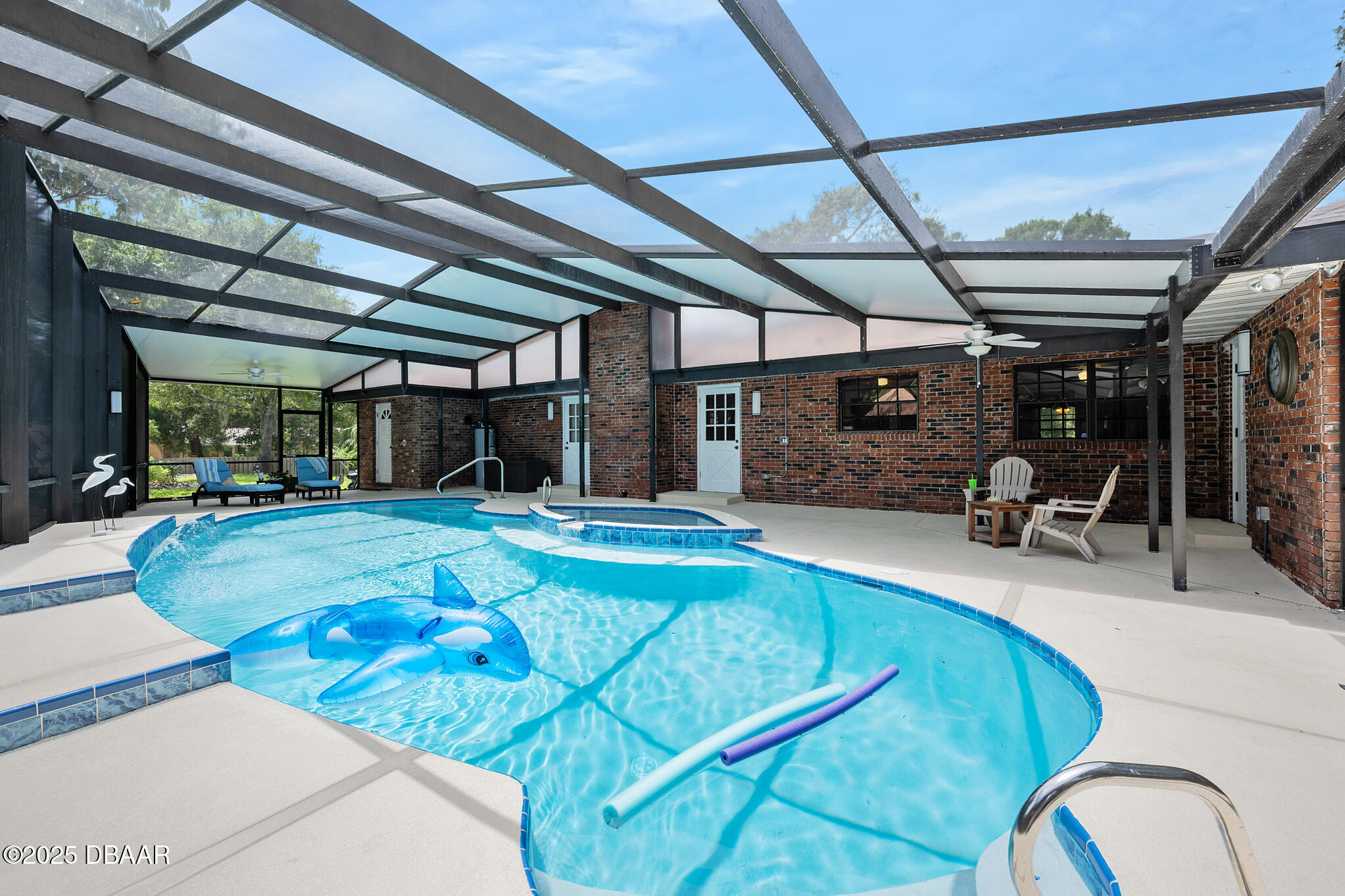 1 River Bluff Court Ormond Beach, FL 32174 - Photo 21 of 58 a view of a swimming pool with a patio