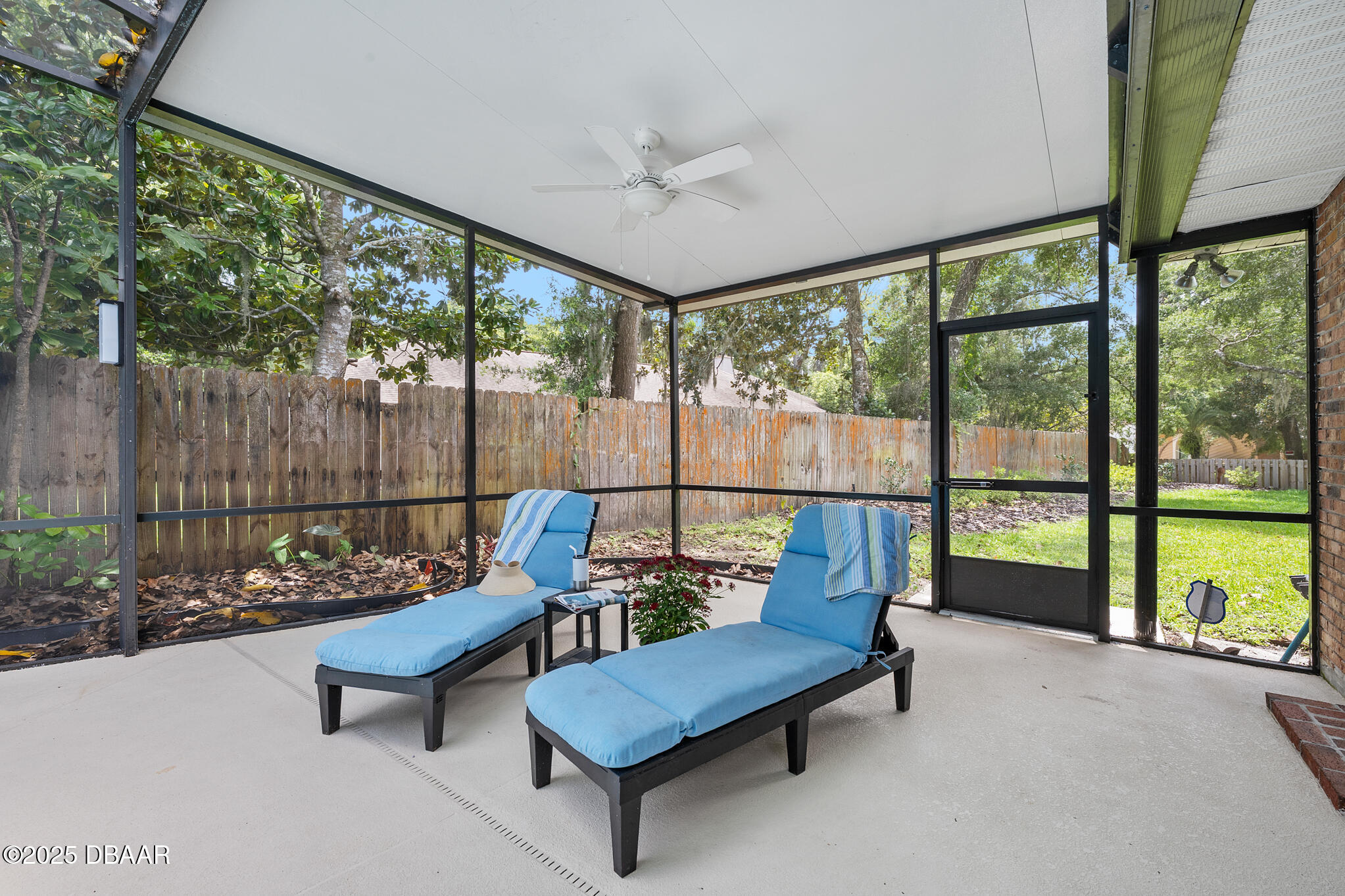 1 River Bluff Court Ormond Beach, FL 32174 - Photo 24 of 58 a building outdoor space with patio furniture and a garden