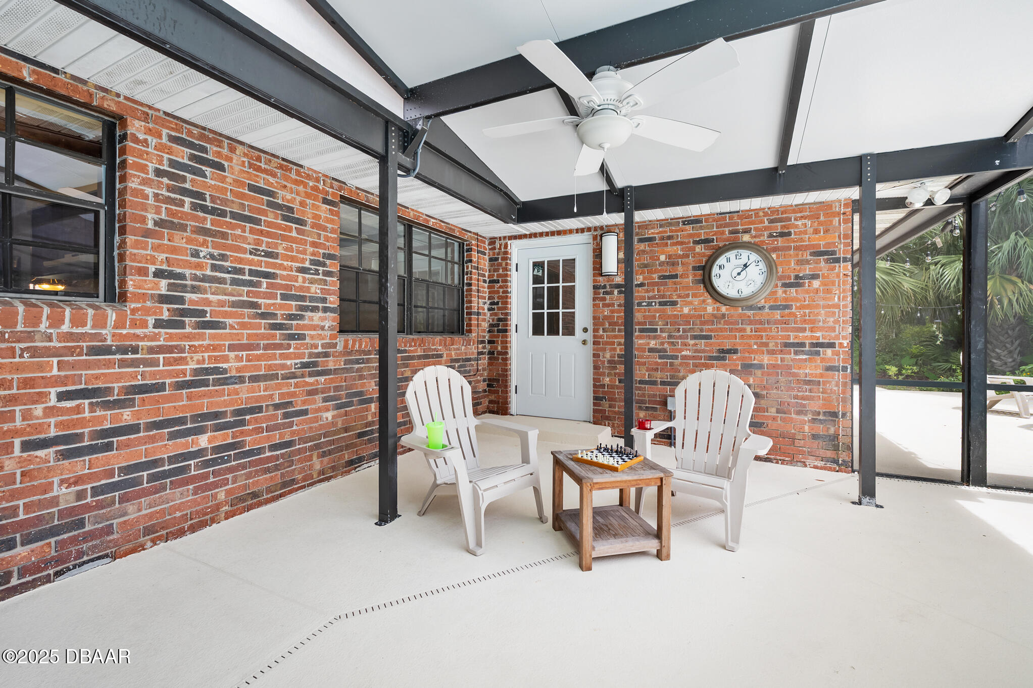 1 River Bluff Court Ormond Beach, FL 32174 - Photo 25 of 58 a building outdoor space with patio furniture and potted plants
