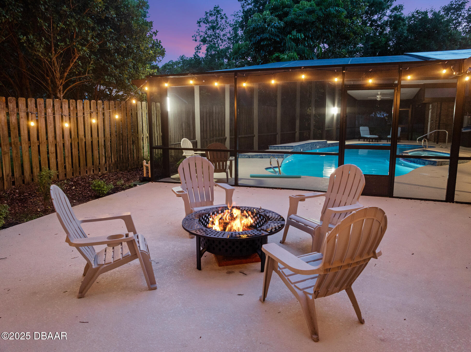 1 River Bluff Court Ormond Beach, FL 32174 - Photo 28 of 58 a outdoor living space with chairs and a fireplace
