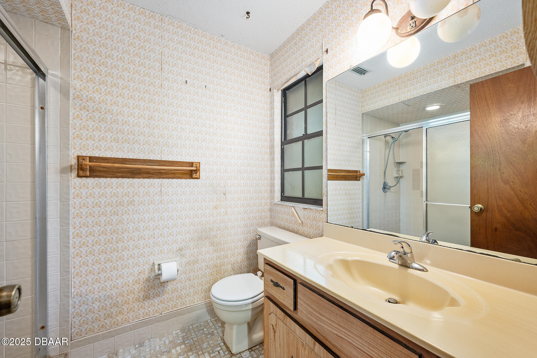 1 River Bluff Court Ormond Beach, FL 32174 - Photo 34 of 58 a bathroom with a sink a toilet and shower