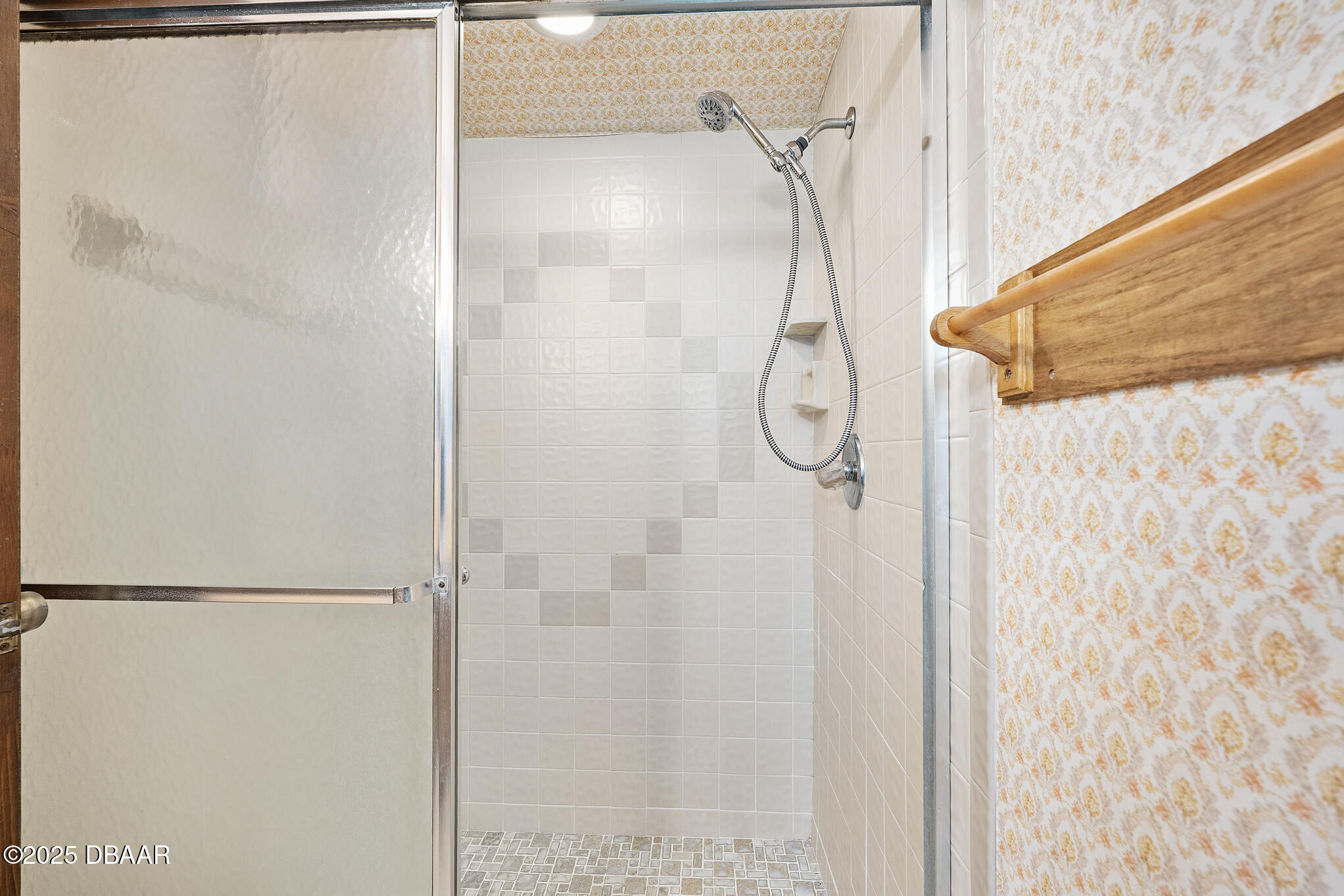 1 River Bluff Court Ormond Beach, FL 32174 - Photo 35 of 58 a bathroom with a glass shower door