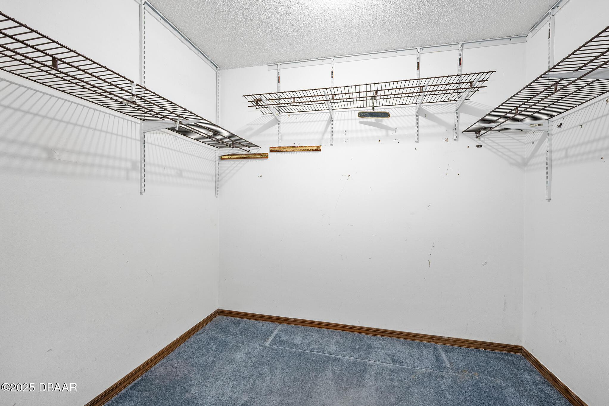 1 River Bluff Court Ormond Beach, FL 32174 - Photo 36 of 58 a view of a room with racks on the wall