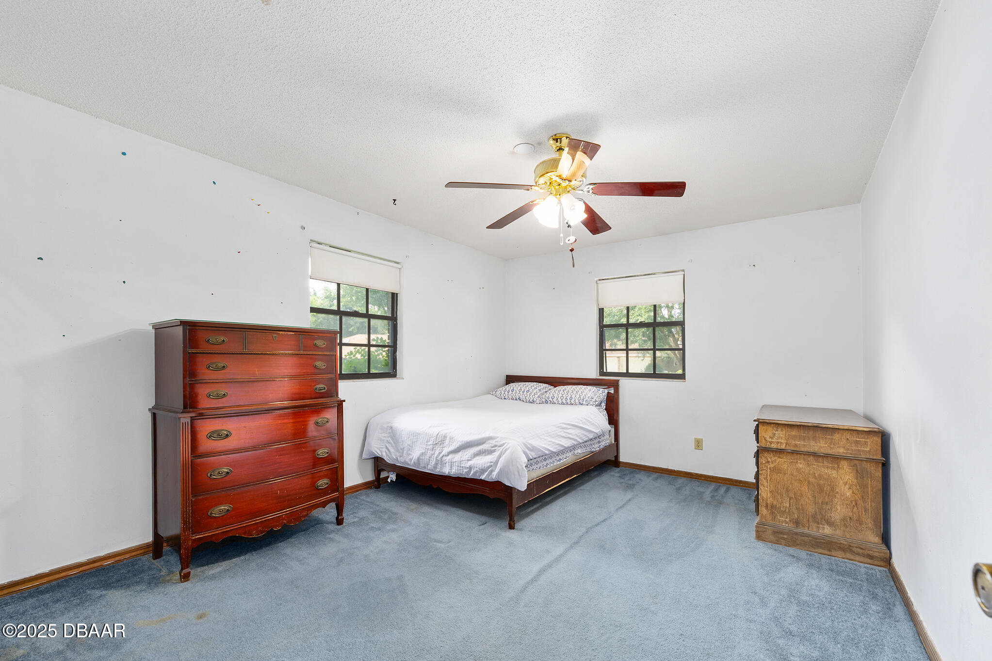 1 River Bluff Court Ormond Beach, FL 32174 - Photo 40 of 58 a bed room with a bed and a ceiling fan