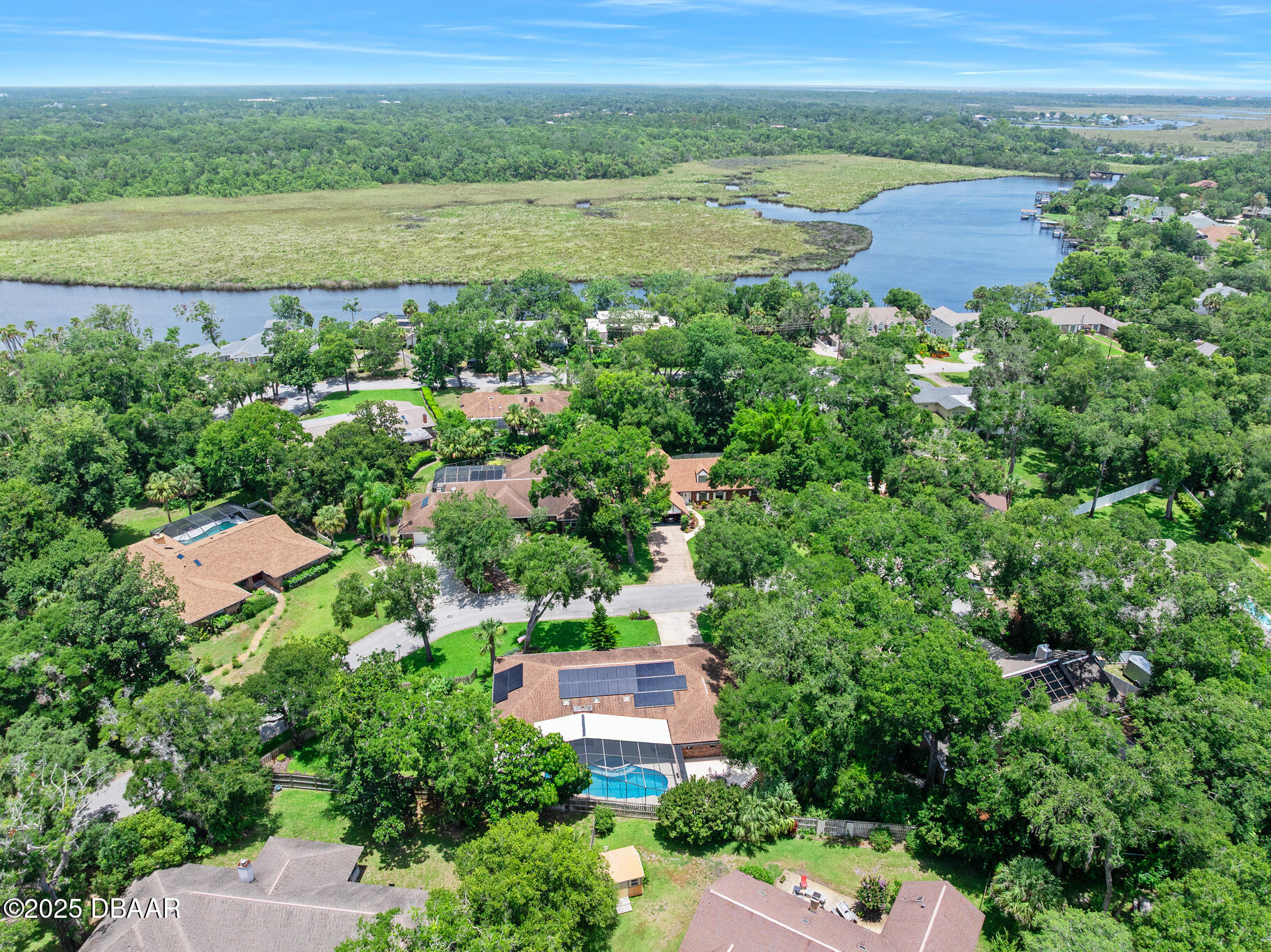 1 River Bluff Court Ormond Beach, FL 32174 - Photo 53 of 58 an aerial view of residential houses with outdoor space and trees