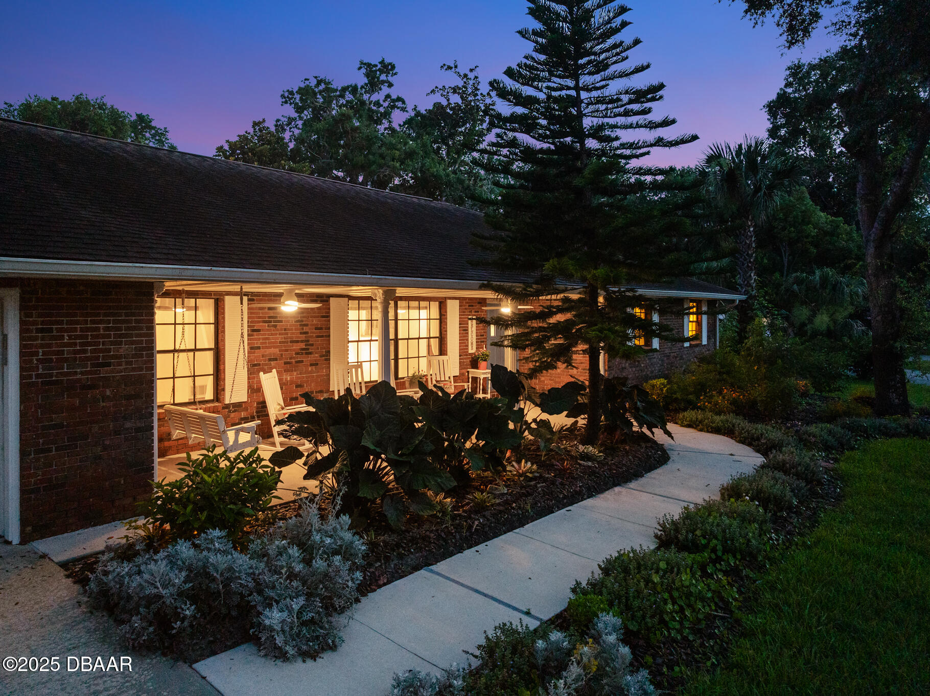 1 River Bluff Court Ormond Beach, FL 32174 - Photo 54 of 58 a view of a back yard of the house and sitting area