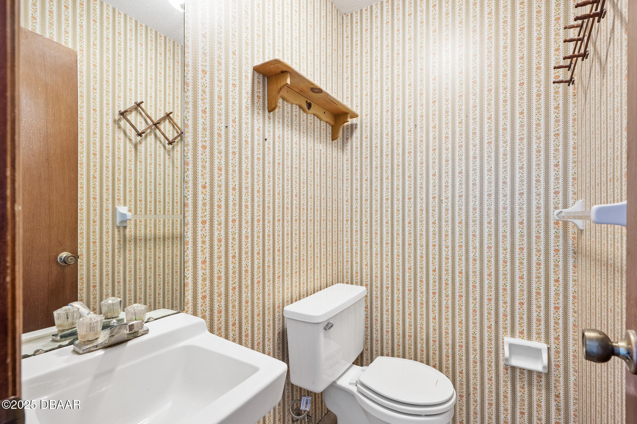 1 River Bluff Court Ormond Beach, FL 32174 - Photo 58 of 58 a white toilet sitting next to a bathroom sink