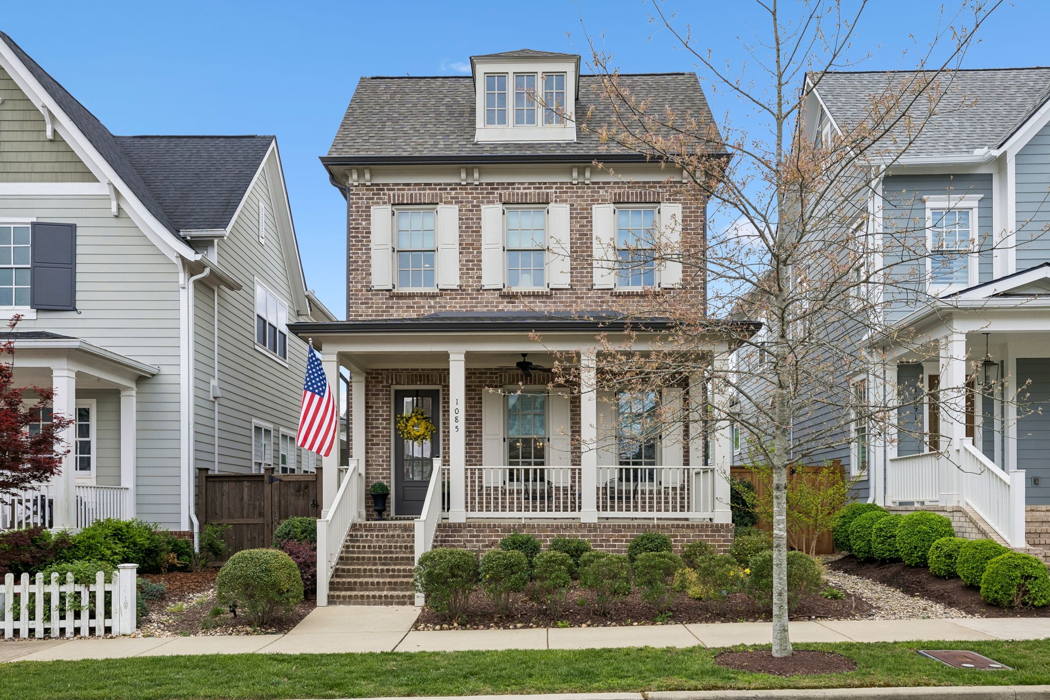 a front view of a house with a yard