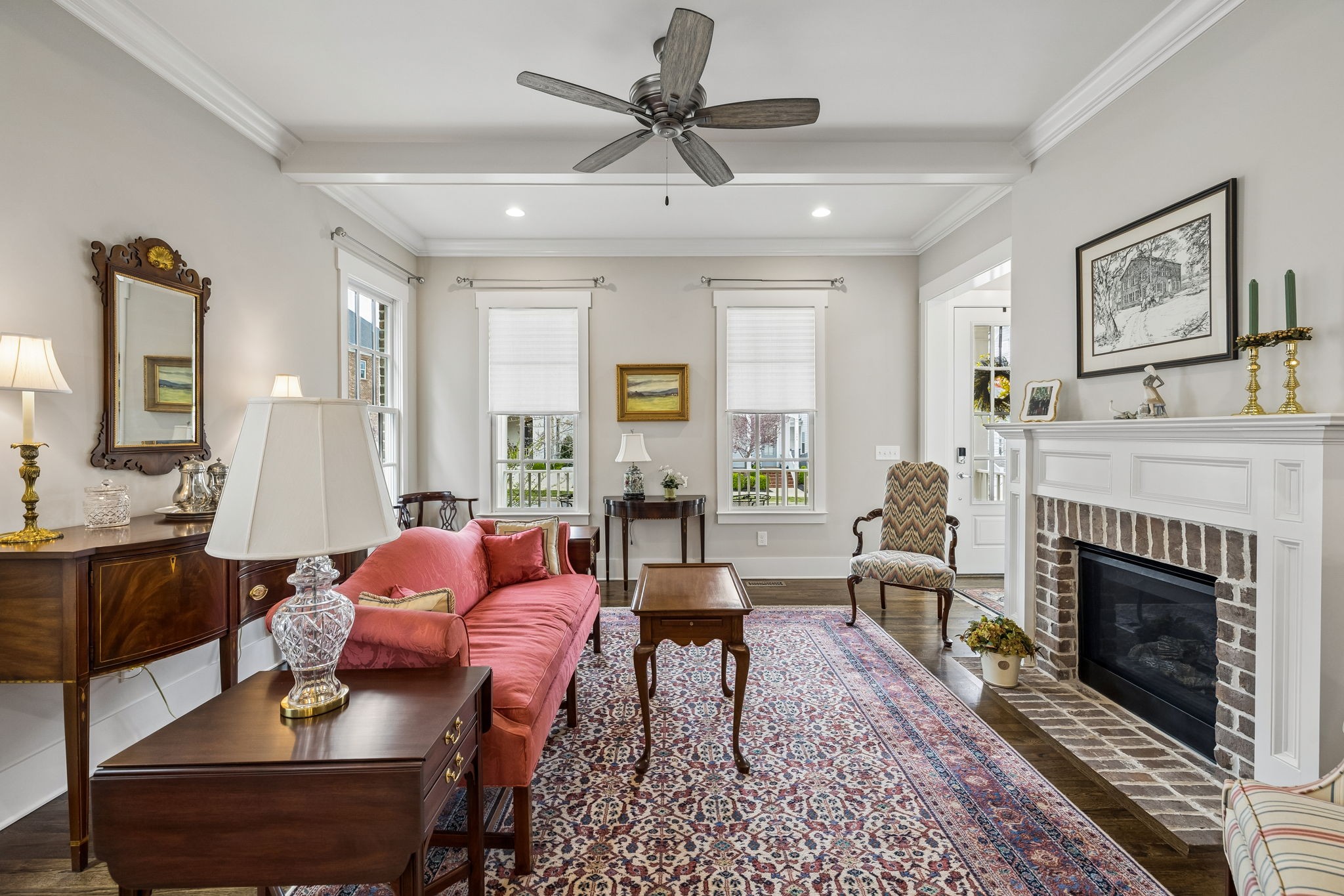1085 Beckwith Street Franklin, TN 37064 - Photo 14 of 42 a living room with furniture a fireplace and a chandelier