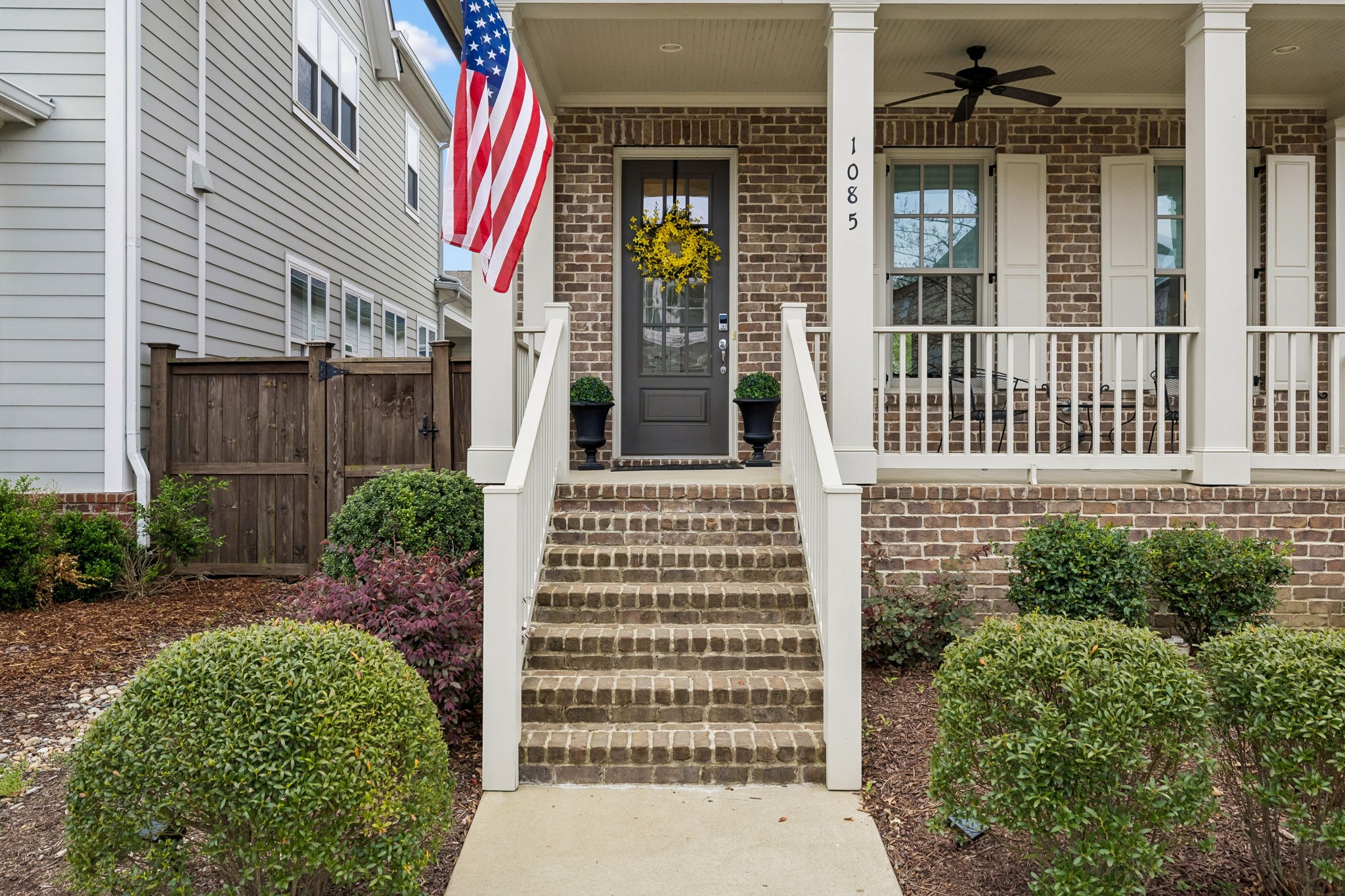 1085 Beckwith Street Franklin, TN 37064 - Photo 4 of 42 front view of a brick house with a small window