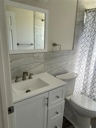 a bathroom with a sink and a toilet