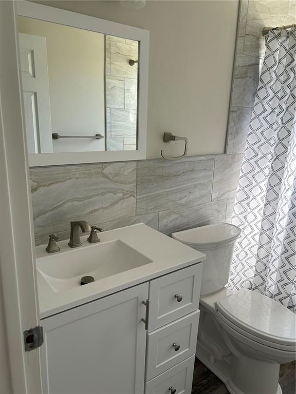24024 Deer Road Astor, FL 32102 - Photo 15 of 31 a bathroom with a sink and a toilet