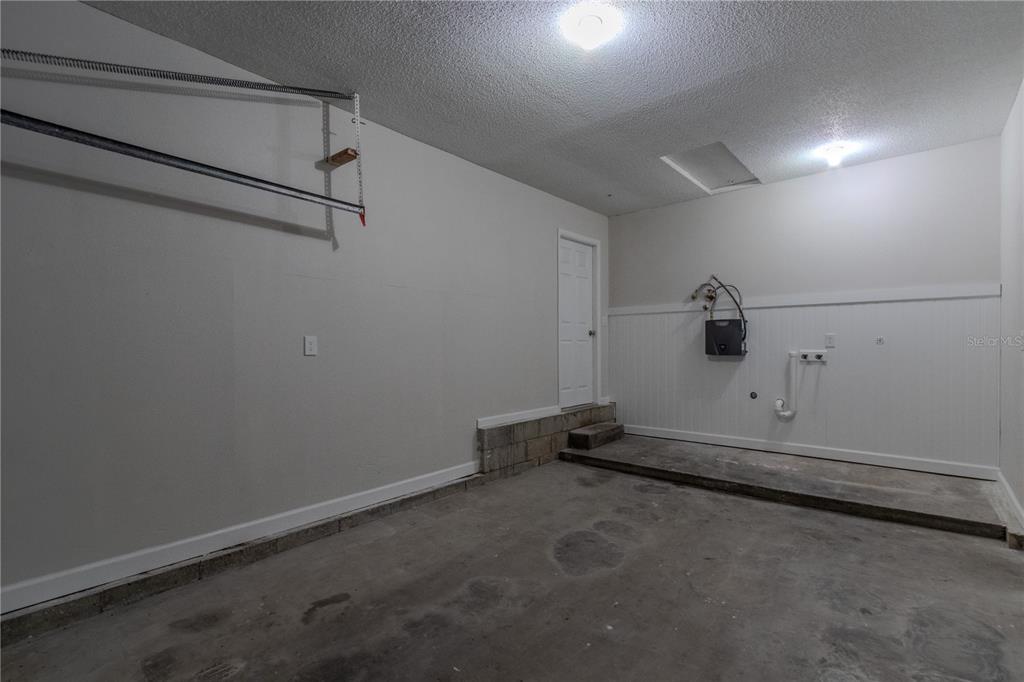 24024 Deer Road Astor, FL 32102 - Photo 19 of 22 a view of a room with racks on the wall