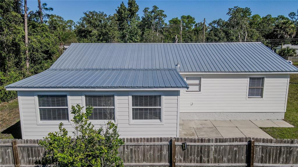 24024 Deer Road Astor, FL 32102 - Photo 20 of 22 a house view with a garden space