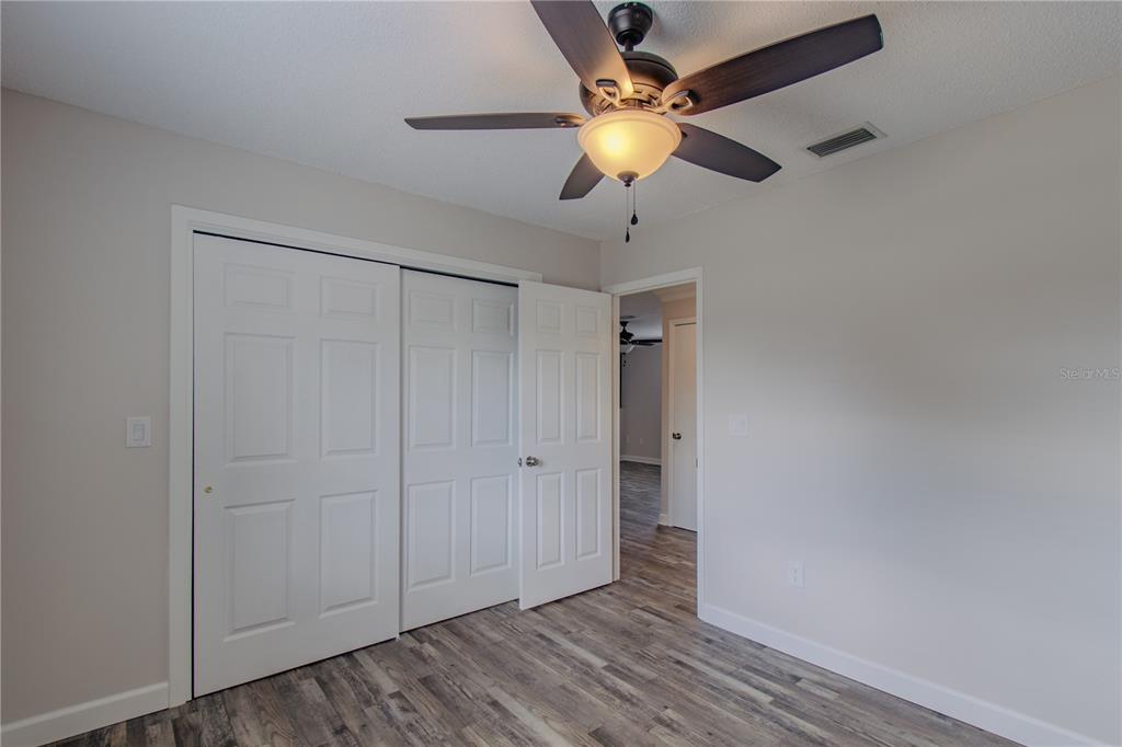 24024 Deer Road Astor, FL 32102 - Photo 21 of 31 wooden floor in an empty room
