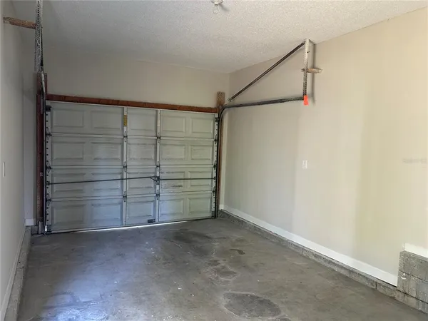 a view of an empty room with closet