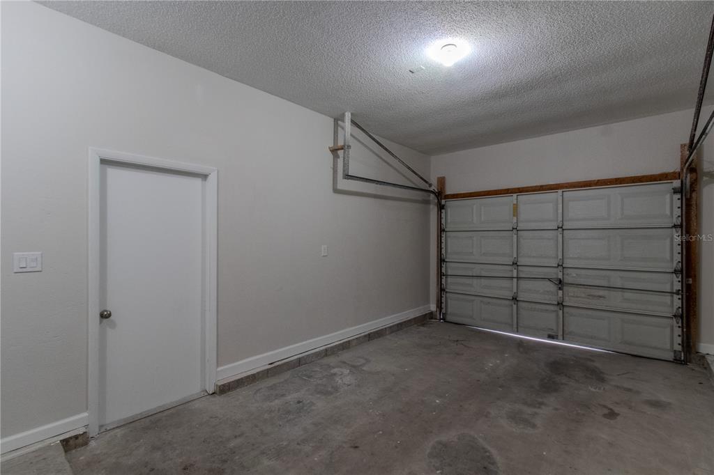 24024 Deer Road Astor, FL 32102 - Photo 25 of 31 a view of a garage