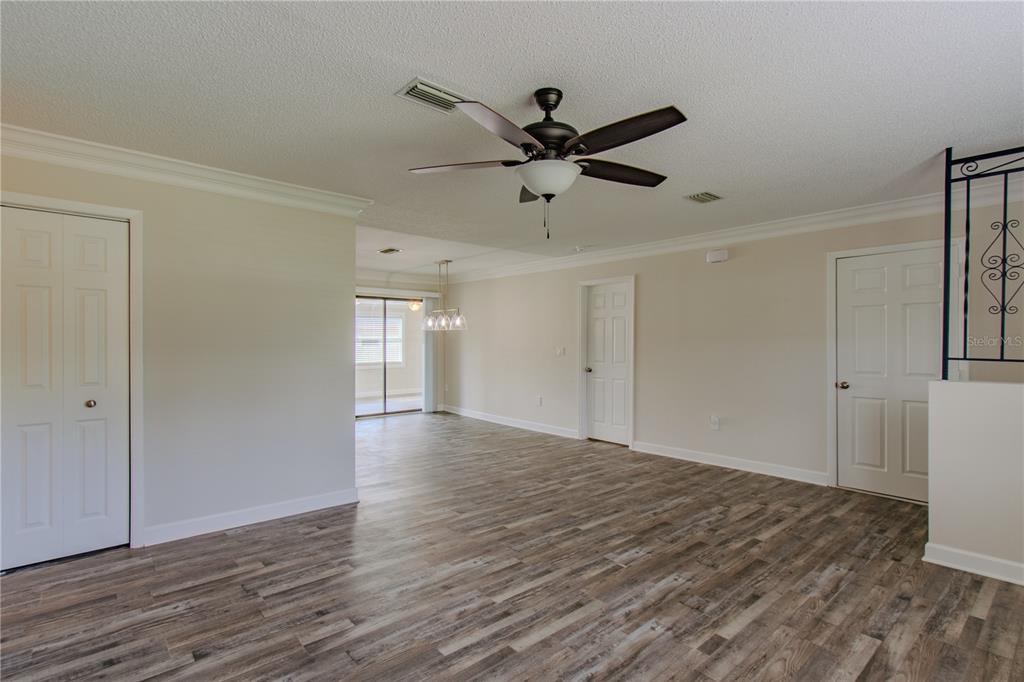 24024 Deer Road Astor, FL 32102 - Photo 4 of 22 a view of an empty room and wooden floor