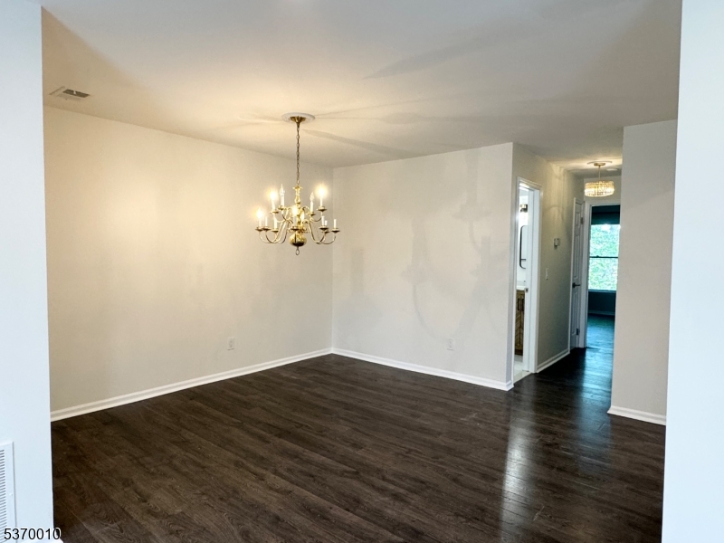 76 Jamestown Road Bernards, NJ 07920 - Photo 7 of 20 wooden floor in an empty room with a window