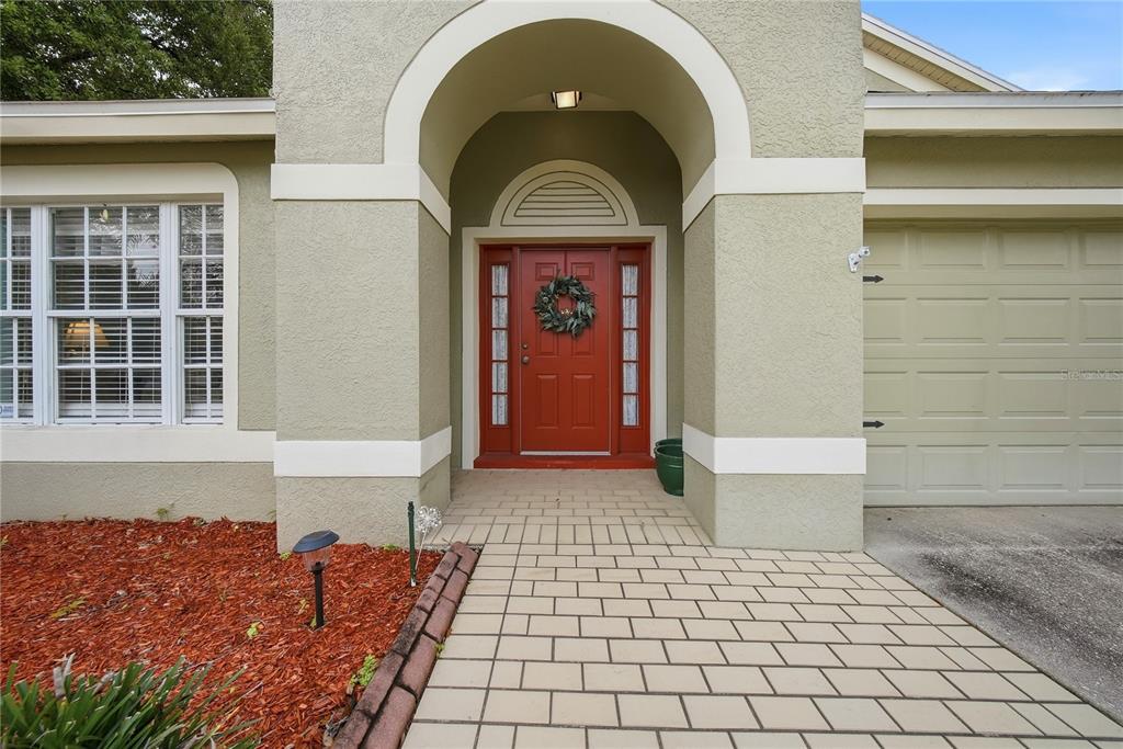 5856 Count Turf Lane Wesley Chapel, FL 33544 - Photo 11 of 57 a view of front door of house with stairs