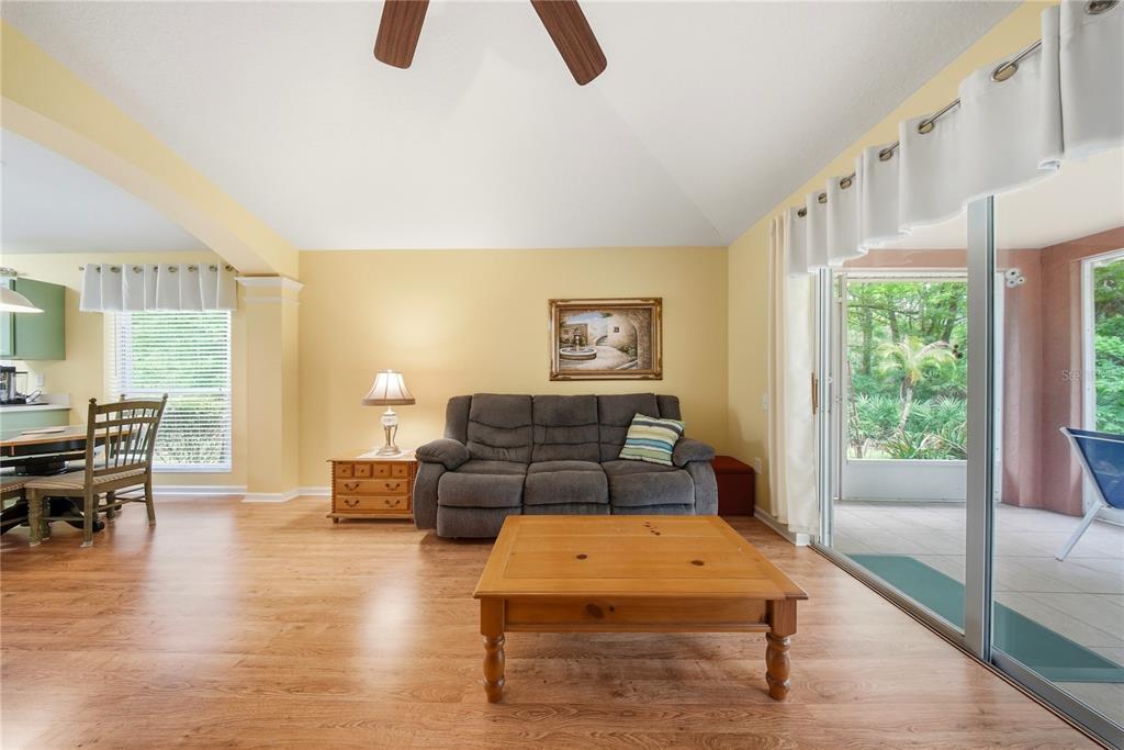 5856 Count Turf Lane Wesley Chapel, FL 33544 - Photo 17 of 57 a living room with furniture and a table